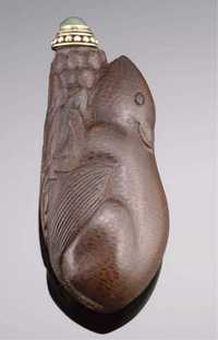 1780-1850 A bamboo snuff bottle carved in the form of a squirrel